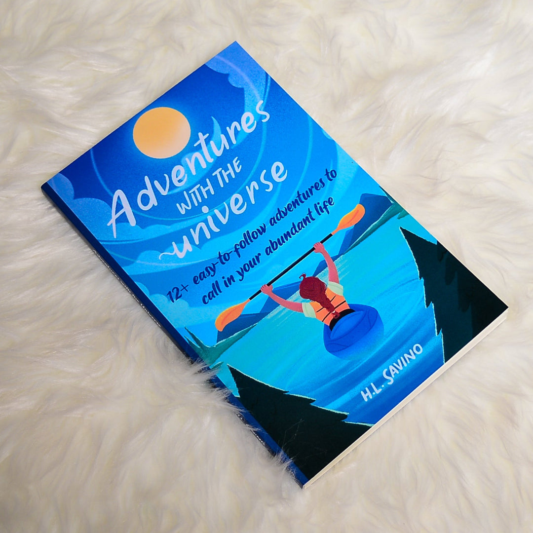 Adventures with the Universe book on white blanket