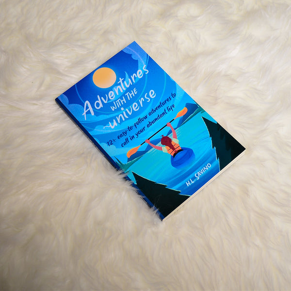 paperback on white blanket