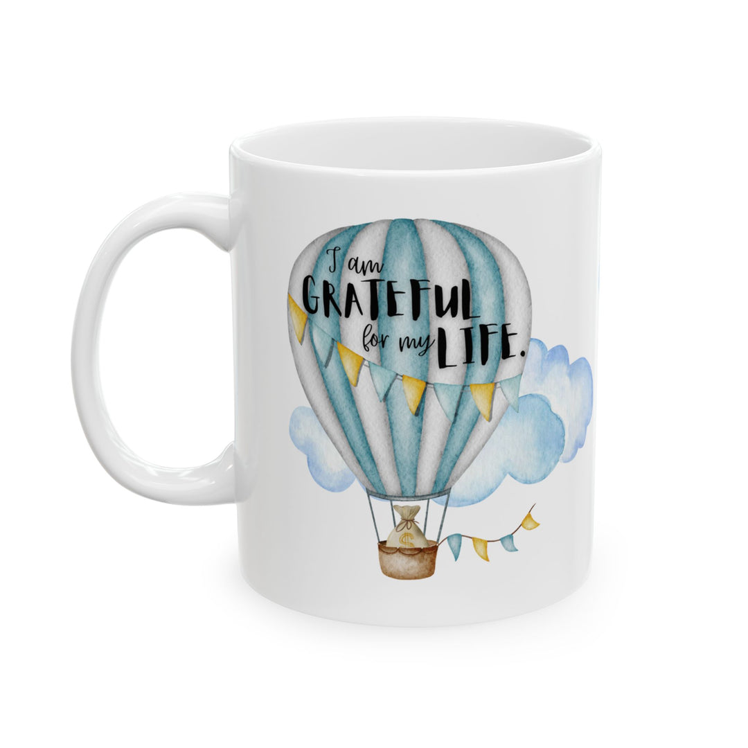 pic of mug that says "I am grateful for my life" with a balloon