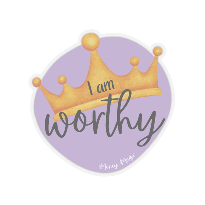 Shows a purple irregular circle with a crown in the middle. Says "I am worthy" and at the bottom "Money magic" smaller. On clear background