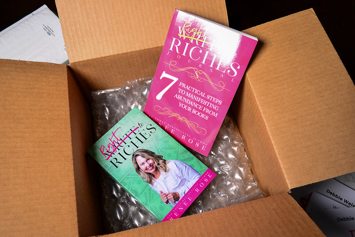 Write to Riches book and journal in a cardboard box with bubble wrap.